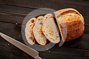 Homemade tartine bread on dark wooden table