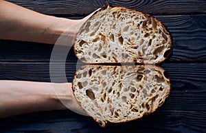 Homemade tartine bread in woman`s hands