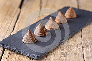 Homemade Tasty Chocolate Truffle Candy on the Old Wooden Background Candy Dessert