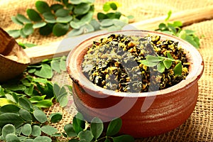 Homemade tasty  moringa leaves curry. cooked in clay pottery.