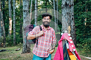 Homemade Tent Camping for free man. Summer camp and nature tourism. Go Ape Adventure. Happy man in summer.