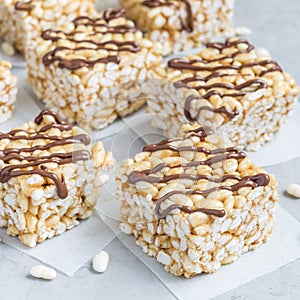 Homemade three ingredients bar with crispy rice, honey and peanut butter, square format