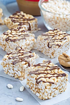 Homemade three ingredients bars: crispy rice, honey and peanut butter vertical