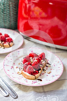 Homemade Toasts with Goat Cheese, Raspberries, Balsamic Cream and Pine Nuts