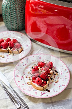 Homemade Toasts with Goat Cheese, Raspberries, Balsamic Cream and Pine Nuts
