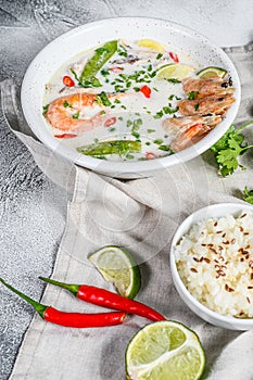 Homemade Tom Kha Gai. Coconut Milk soup in a bowl. Thai food. gray background. Top view