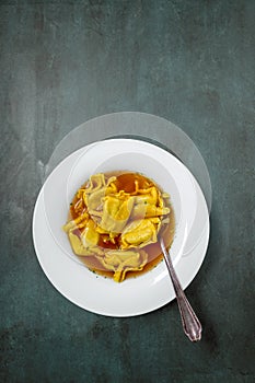 Homemade tortellini in broth