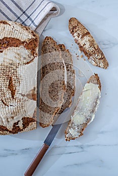 Homemade traditional bread. Sliced bread crumbs knife and cumin