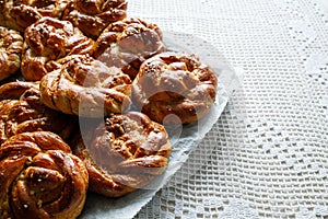 Homemade traditional cinnamon - cardamom sweet buns, close up view.