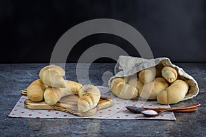 Homemade Traditional Czech pastry - white bread roll rohlik with salt and poppy seeds