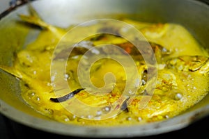 Homemade traditional dishes Pindang mackerel on a simmering pan