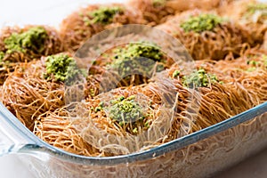 Homemade Turkish Dessert Fincan Kadayif Baklava / Baklawa with Pistachio Powder.