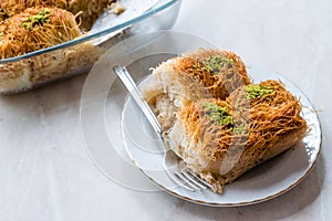 Homemade Turkish Dessert Fincan Kadayif Baklava / Baklawa with Pistachio Powder.