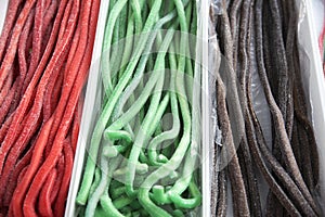 Homemade twisted colorful twisted licorice candies as a background