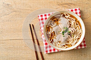 Homemade udon noodles with pork in soy or shoyu soup