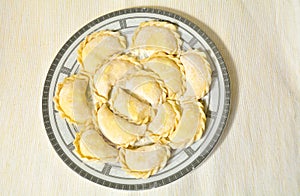 Homemade uncooked ravioli on the plate