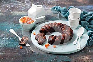Homemade vegan bundt cake with carob or chocolate and candied orange peel