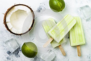 Homemade vegan frozen coconut mojito popsicles - ice pops - paletas. photo