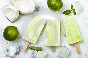 Homemade vegan frozen coconut mojito popsicles - ice pops - paletas. photo