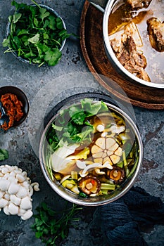 Homemade vegetable broth with beef bone broth with ingredients