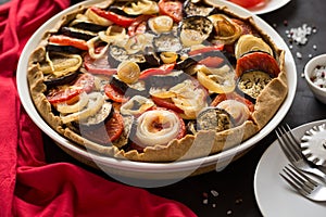 Homemade vegetable pie galette with grilled eggplants, tomatoes and onion