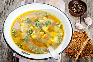 Homemade vegetable soup with broccoli, cauliflower, carrots in a bowl