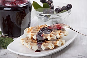 Homemade waffles with chokeberry jam