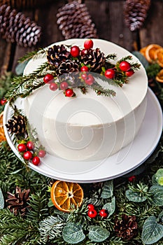 Homemade white cream naked cake decorated with white cream, cone