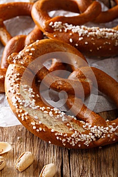 Homemade whole meal pretzels with salt close-up. Vertical