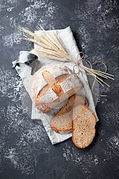 Homemade whole wheat bread on a grey background