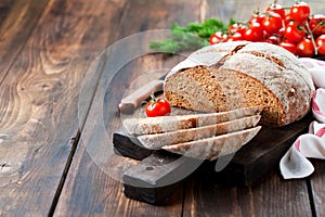 Homemade whole wheat bread with sundried tomatoes and herbs photo