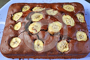 Homemade Wholemeal Chocolate Banana Cake on a Blue Plate