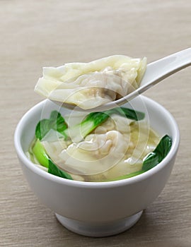 Homemade wonton soup with bok choy: a kind of chinese dumpling