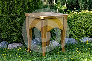 Homemade wood stool against the backdrop of nature