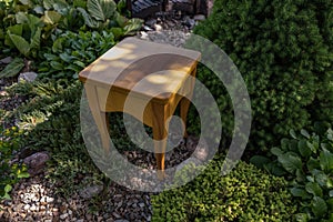 Homemade wood stool against the backdrop of nature