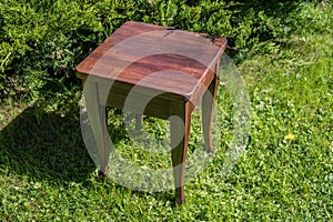 Homemade wood stool against the backdrop of nature