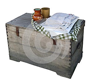 Homemade wooden chest, clay jugs and linen isolated