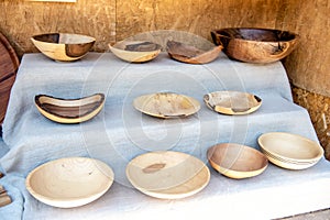 Homemade wooden plates. The art of wood carving. Wood utensils. handiwork. The art of wood carving. Eco-friendly utensils