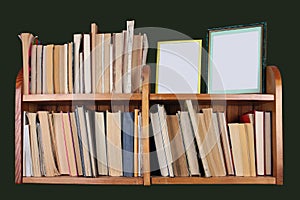 Homemade wooden shelf with books and photos isolated