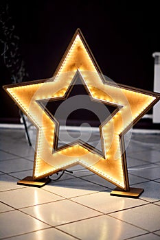 Homemade wooden star with led lighting and decoration events.