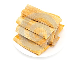 Homemade Wrapped Tamales on a Plate photo