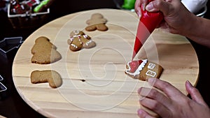 Homemade Xmas cookie for Christmas and Happy New Year. Woman cooking gingerbread with friend and Family on winter holiday