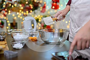 Homemade Xmas cookie for Christmas and Happy New Year. Woman cooking gingerbread with friend and Family on winter holiday