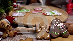 Homemade Xmas cookie for Christmas and Happy New Year. Woman cooking gingerbread with friend and Family on winter holiday at home