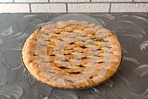 Homemade yeast dough pie. Pastries with sweet fruit filling. Close-up, selective focus