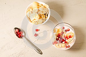 homemade yogurt with pomegranate and flakes in glass/homemade yogurt with pomegranate and flakes in glass and flakes in a bowl on