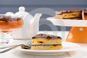 Homemade yummy lowcalorie pumpkin cake on white plates photo