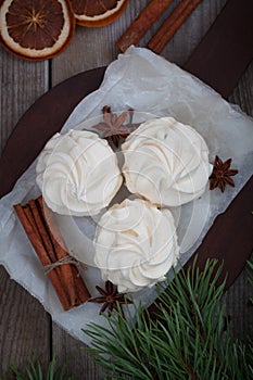 Homemade zephyr or marshmallows with mulled wine cinnamon oranges, anis. Christmas atmosphere. Flat lay