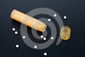 Homeopathic pills and bottle