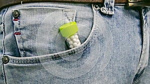 Homeopathic Pills bottle in the Pocket of a Jeans